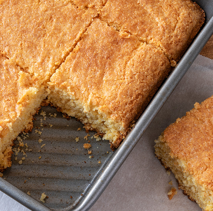 Baking pan with cut pieces of cornbread.