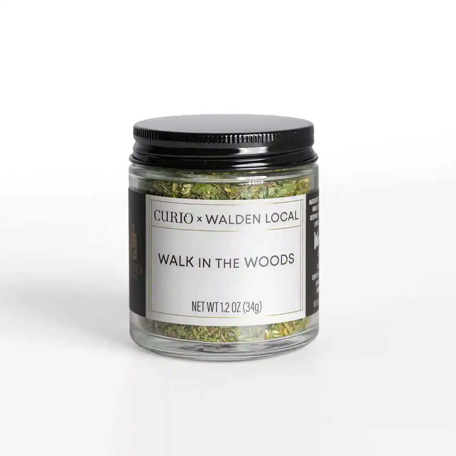 A glass jar of Walk In The Woods, a collaboration spice blend with Walden Local and Curio Spice