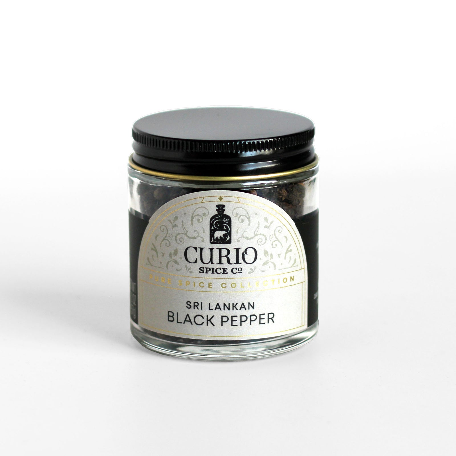 Curio Spice Co. fair-trade single origin sustainable Sri Lankan Black Pepper in a glass jar.