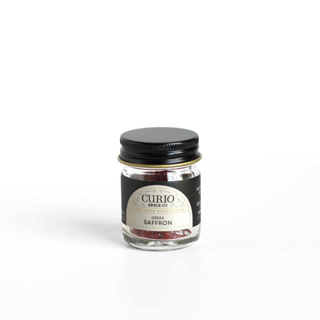 Curio Spice Co. fair-trade single origin sustainable Greek Saffron in a glass jar.