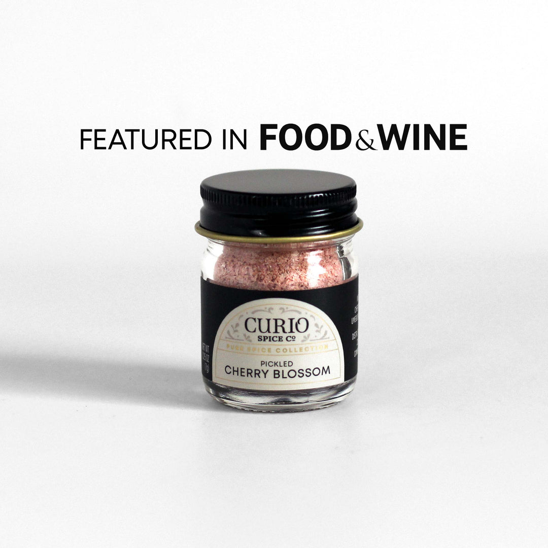 Curio Spice Co. fair-trade single origin sustainable Pickled Cherry Blossom in a glass jar, as featured in Food &amp; Wine.