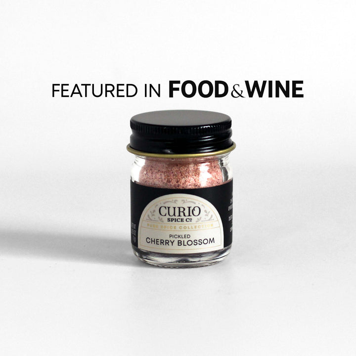 Curio Spice Co. fair-trade single origin sustainable Pickled Cherry Blossom in a glass jar, as featured in Food &amp; Wine.