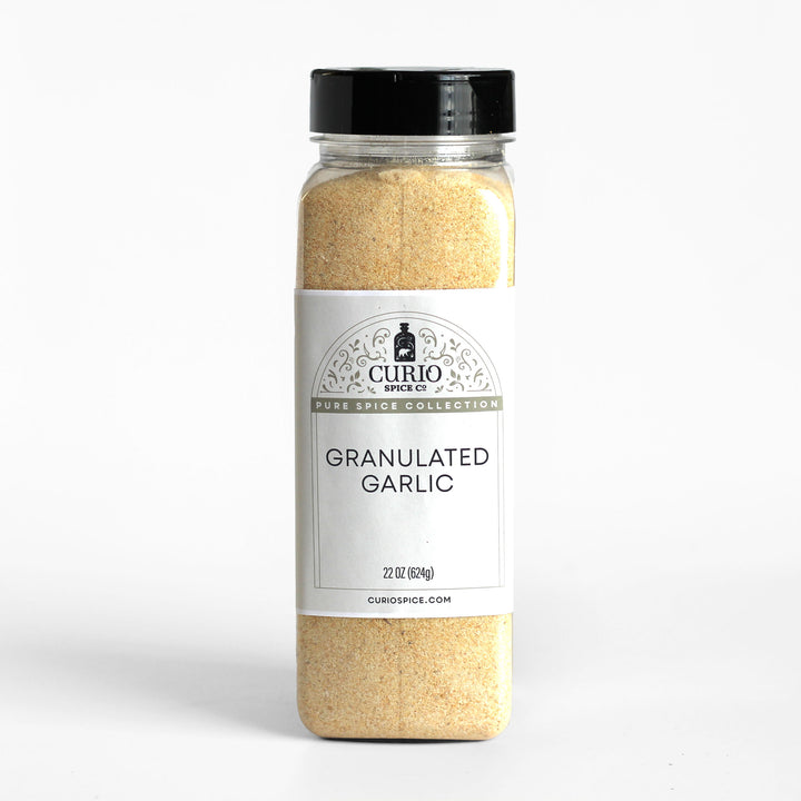 Bulk 22 oz. jar of granulated garlic.