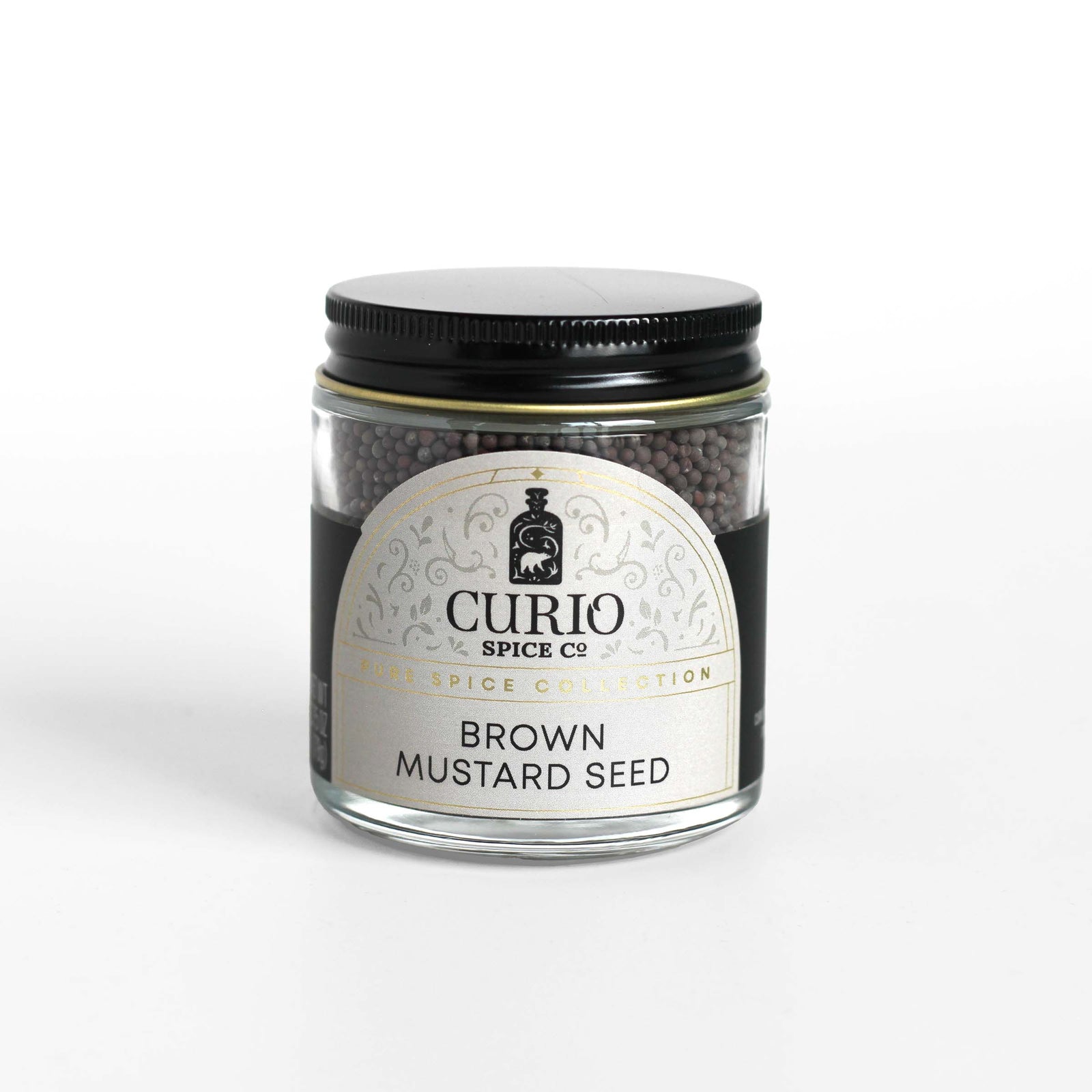 Curio Spice Co. fair-trade single origin sustainable brown mustard seed in a glass jar.