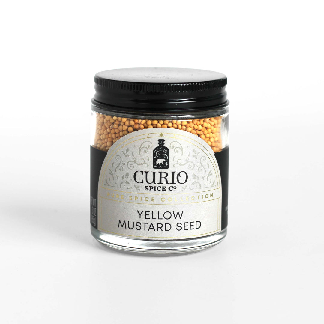Curio Spice Co. fair-trade single origin sustainable yellow mustard seed in a glass jar.