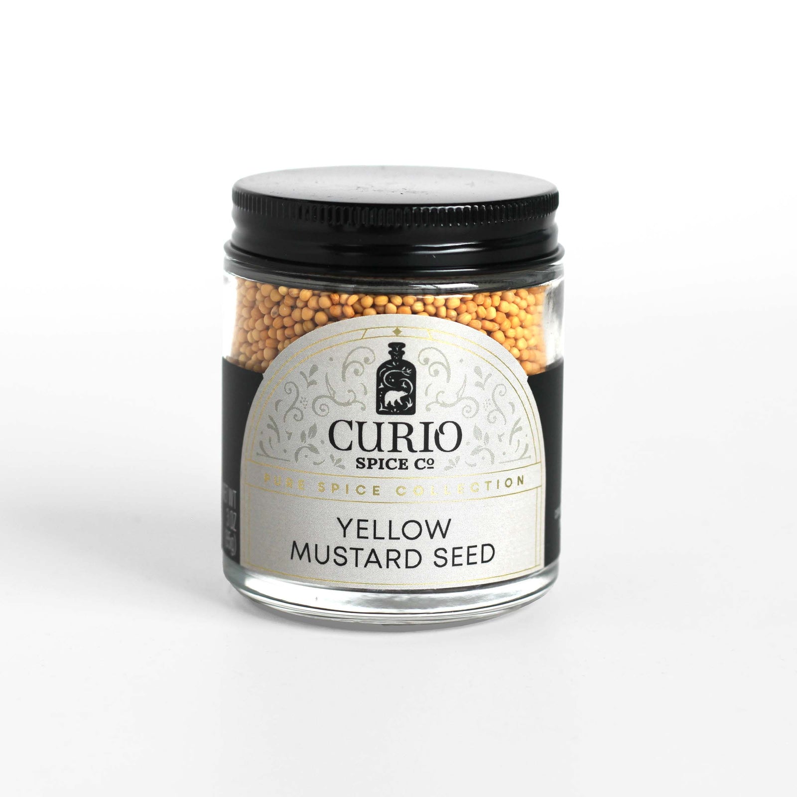 Curio Spice Co. fair-trade single origin sustainable yellow mustard seed in a glass jar.