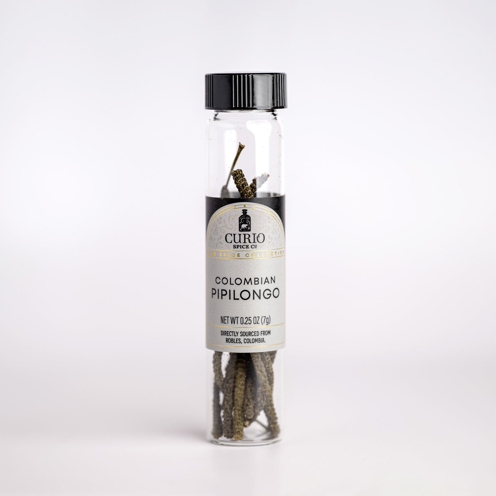 Curio & Co. pipilongo pepper bottle with label on a white background