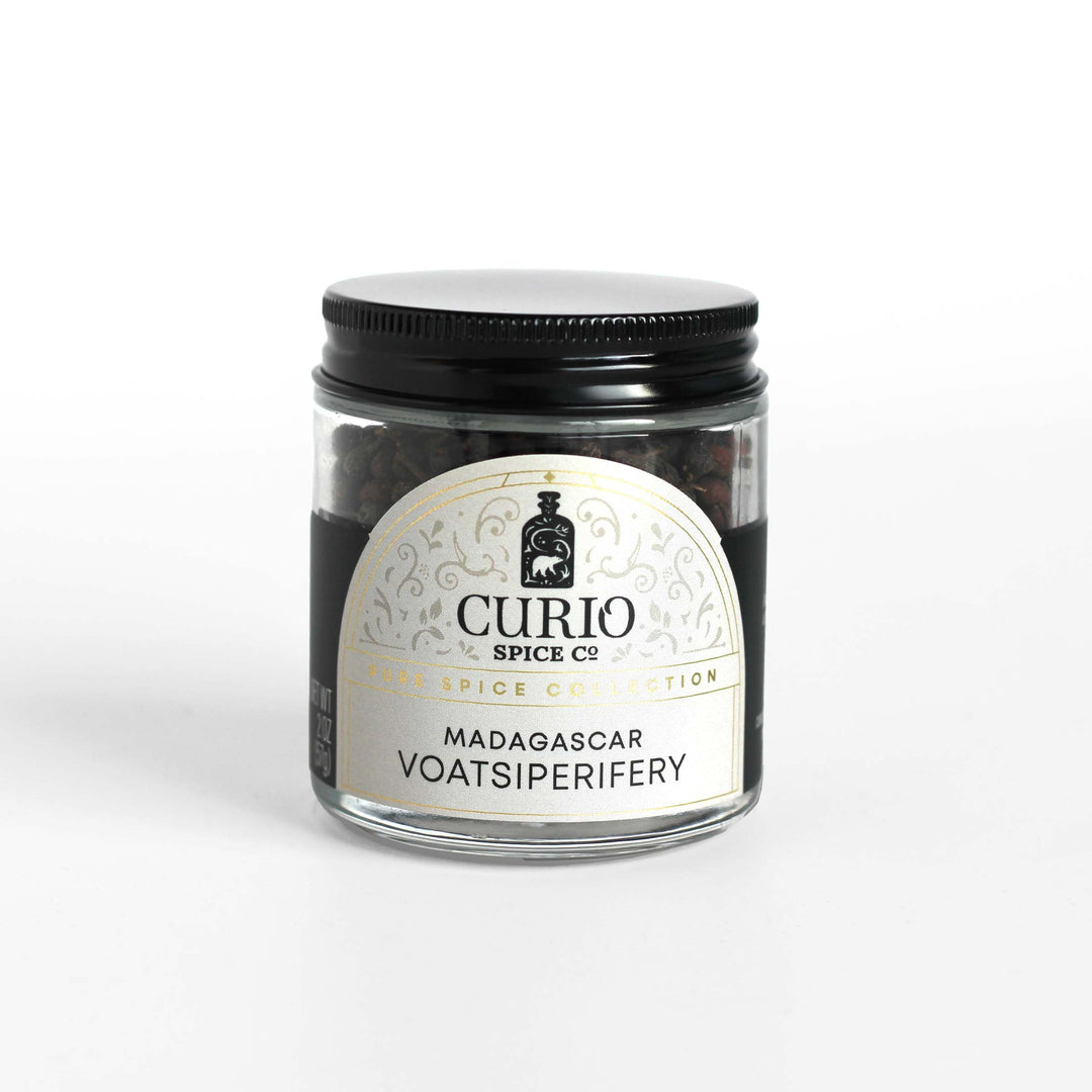 Curio Spice Co. fair-trade single origin sustainable Madagascar Voatsiperifery wild pepper in a glass jar.