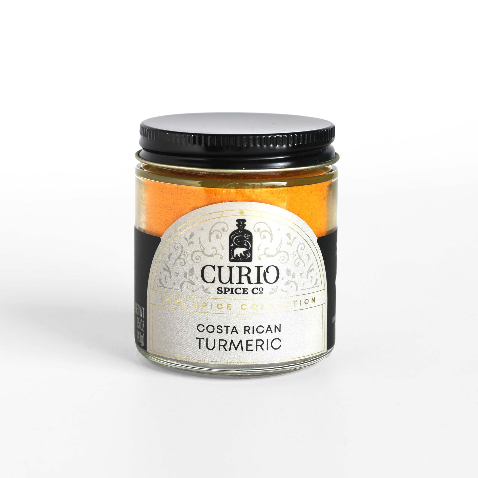 Curio Spice Co. fair-trade single origin sustainable Costa Rican Turmeric in a glass jar.