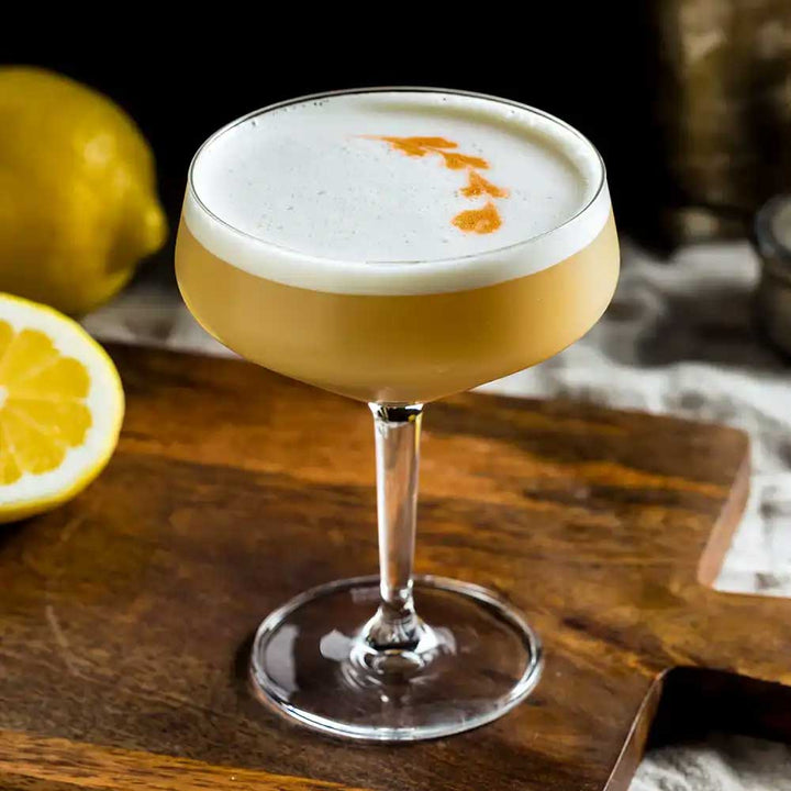 Zenúfana: Golden Sour cocktail sitting on a wooden board