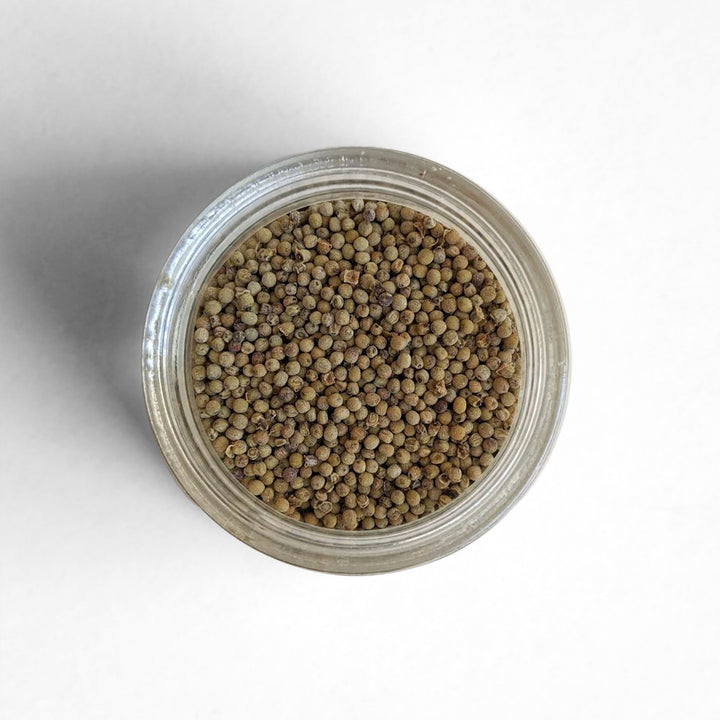 Top-down view of Kampot Long White Peppercorns